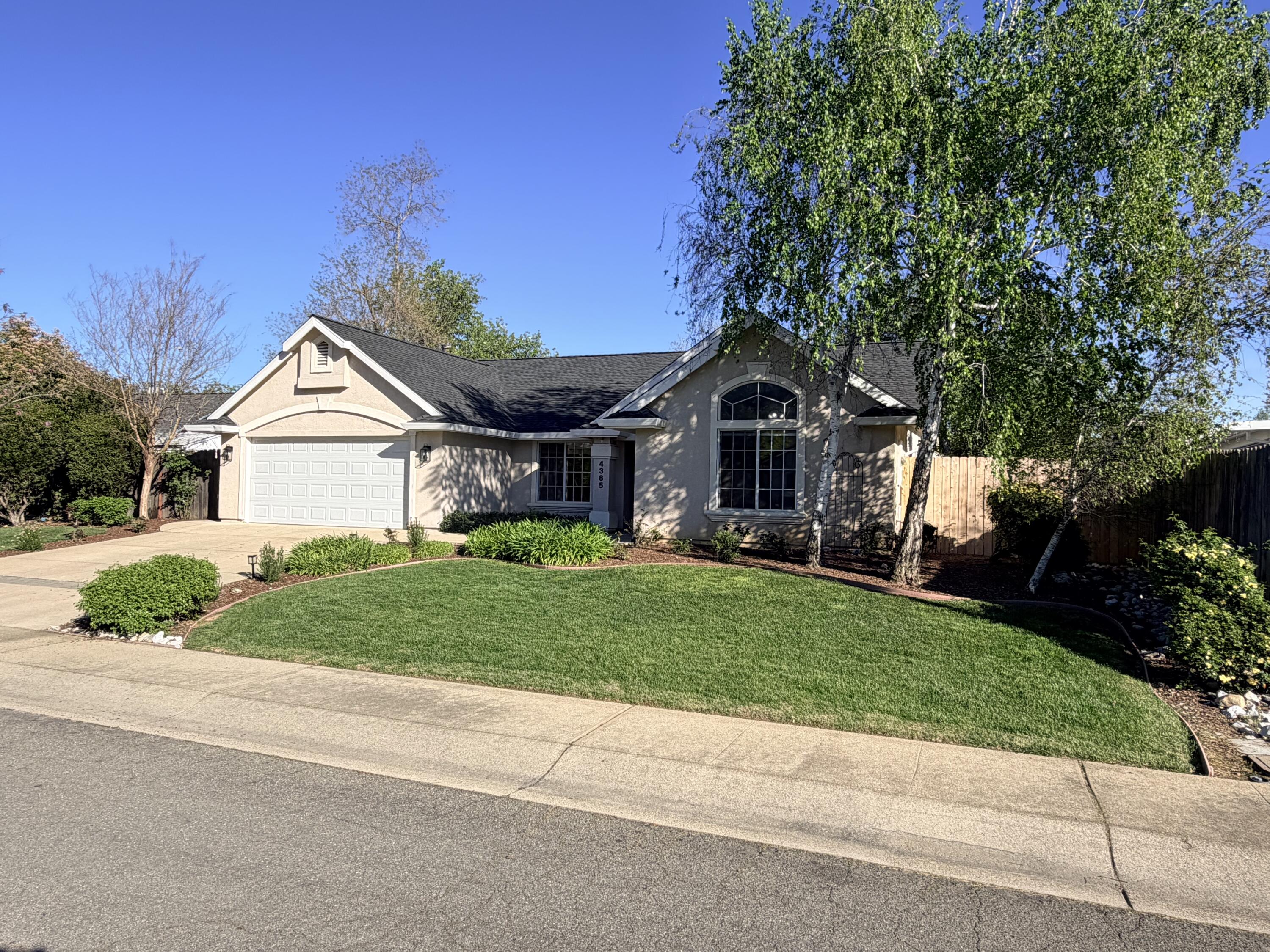 4365 Heather Ridge Lane Redding, CA 96001 - Photo 21 of 21 a front view of a house with a yard