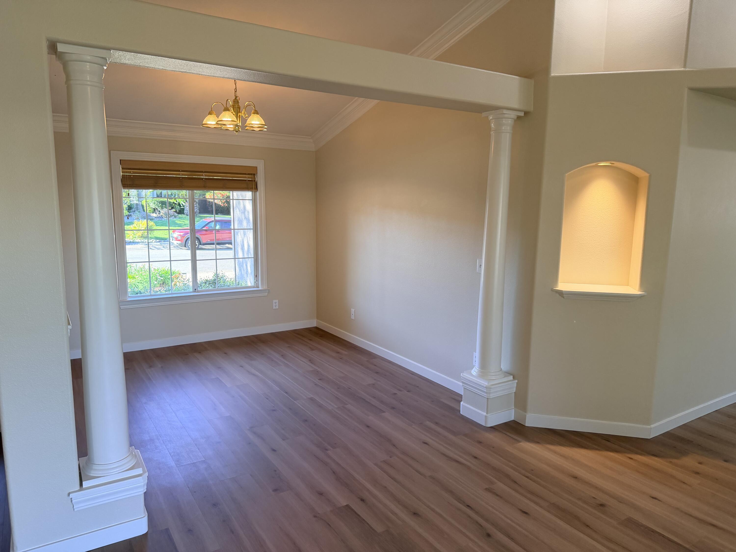 4365 Heather Ridge Lane Redding, CA 96001 - Photo 4 of 21 an empty room with wooden floor and windows