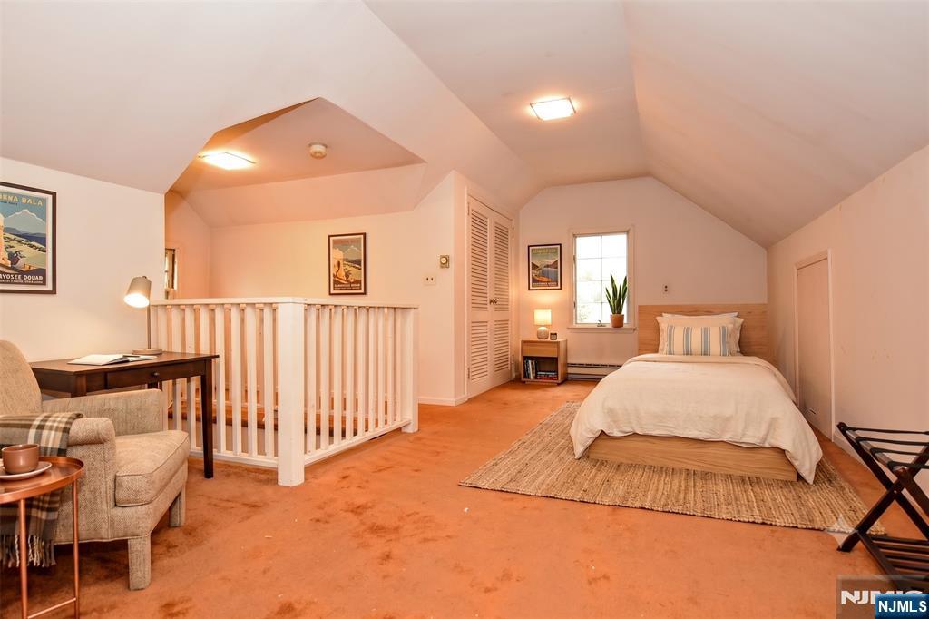 255 Pearsall Avenue Ridgewood, NJ 07450 - Photo 28 of 39 a bedroom with a bed and window