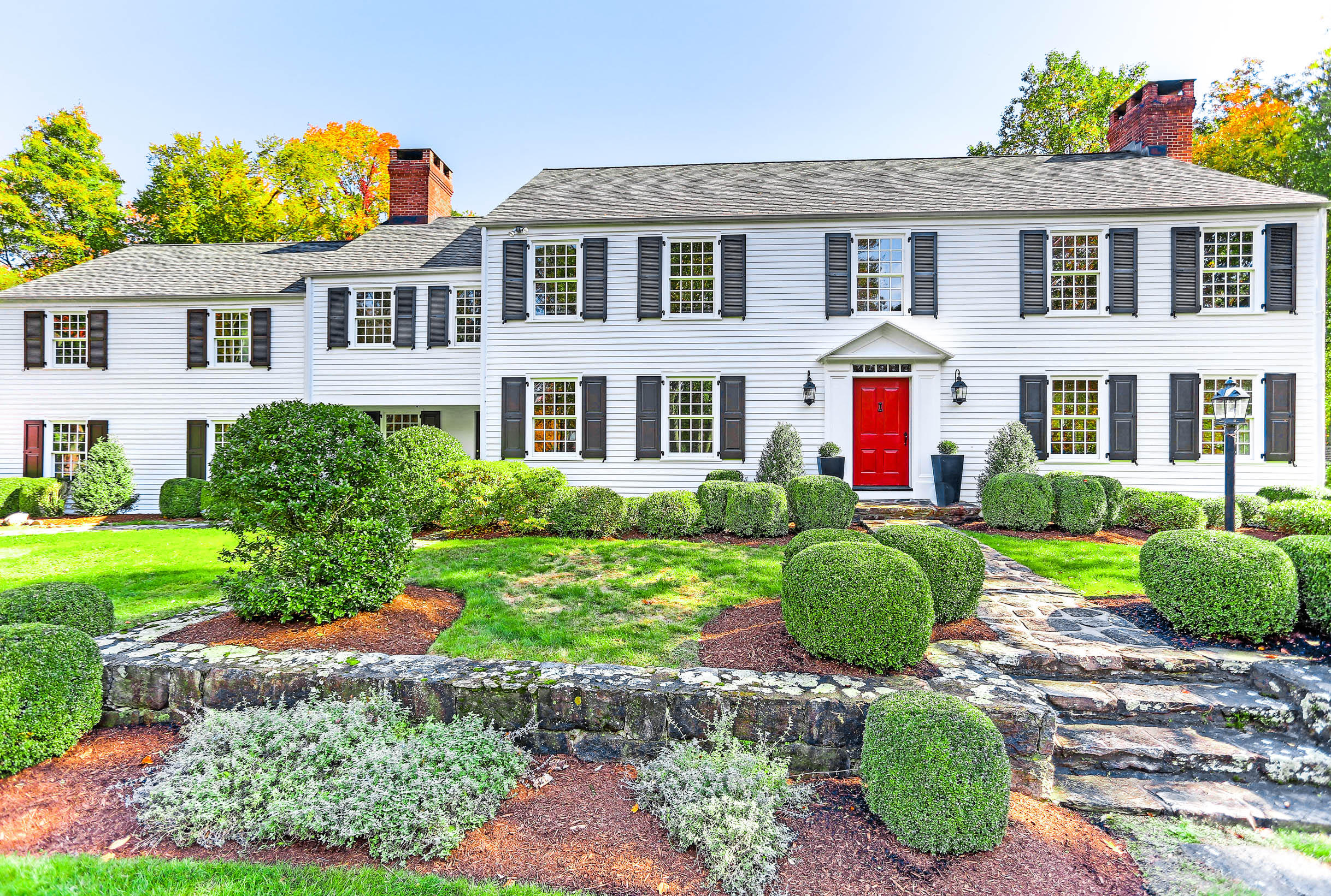 231 Turtle Back Road New Canaan, CT 06840 - Photo 1 of 22 a front view of a house with a yard