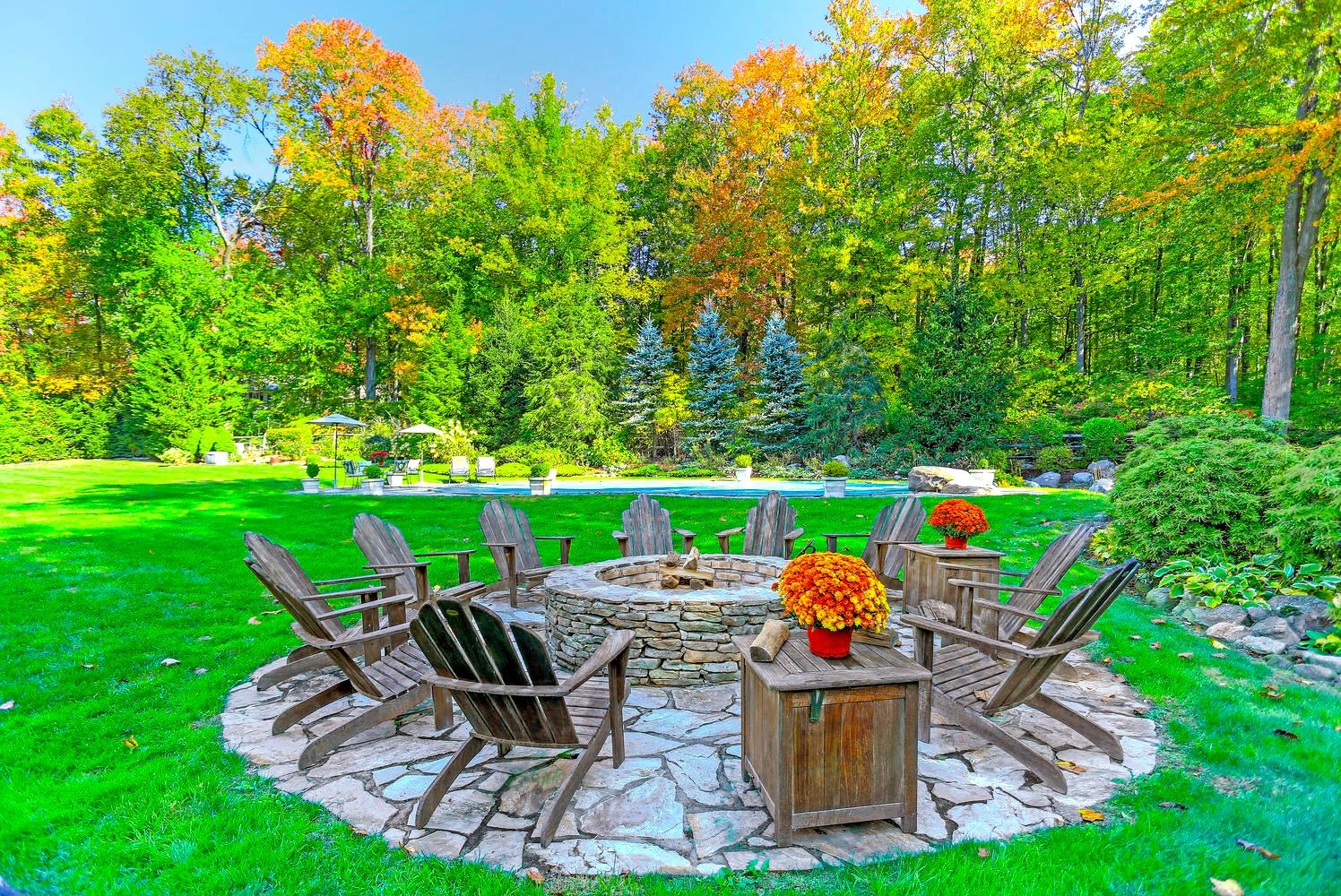 231 Turtle Back Road New Canaan, CT 06840 - Photo 11 of 22 a lawn chairs sitting in the middle of a garden