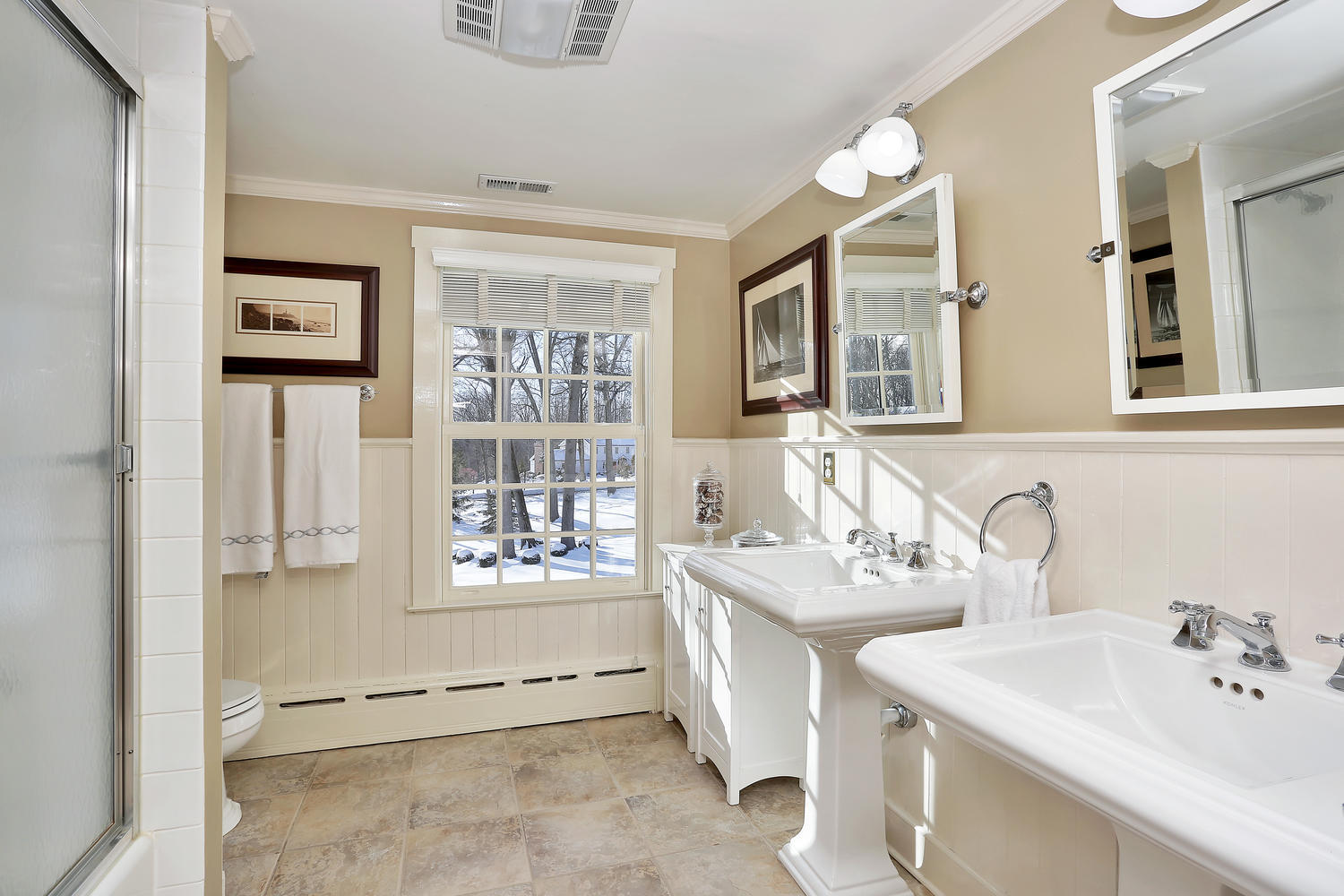 231 Turtle Back Road New Canaan, CT 06840 - Photo 16 of 22 a bathroom with a sink double vanity and a tub