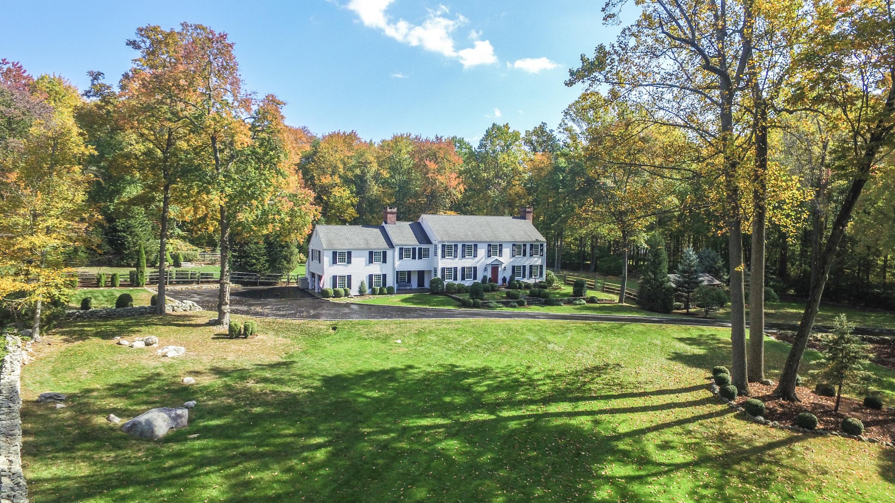 231 Turtle Back Road New Canaan, CT 06840 - Photo 22 of 22 a swimming pool with trees in the background