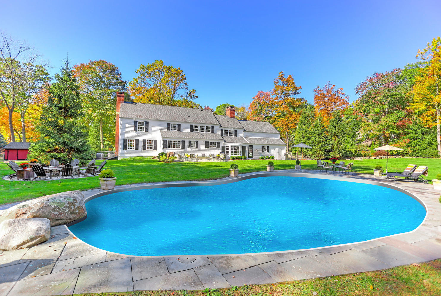231 Turtle Back Road New Canaan, CT 06840 - Photo 3 of 22 a view of a swimming pool with a yard