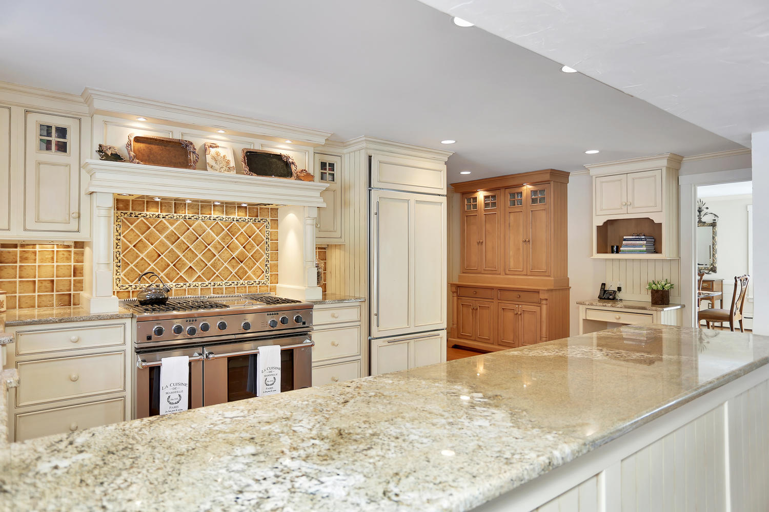 231 Turtle Back Road New Canaan, CT 06840 - Photo 8 of 22 a kitchen with stainless steel appliances granite countertop a stove a sink and a microwave