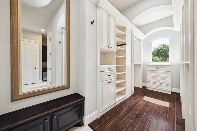 a view of wooden floor and windows in a room