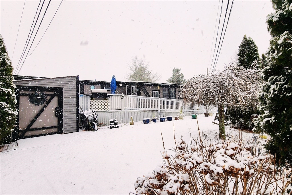 3040 Cranberry Highway, Unit 34 Wareham, MA 02538 - Photo 13 of 14 a view of a house with snow on the road