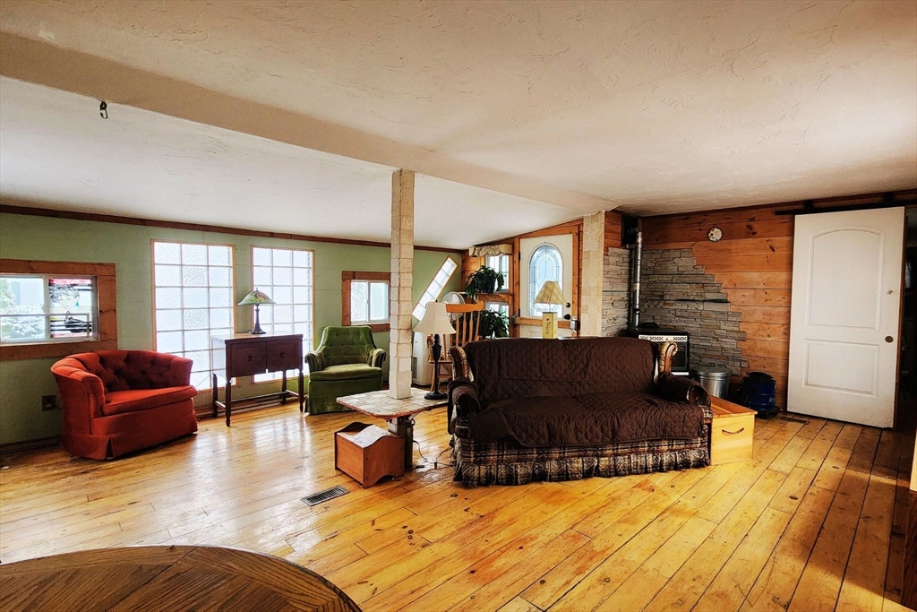 3040 Cranberry Highway, Unit 34 Wareham, MA 02538 - Photo 3 of 14 a living room with furniture window and wooden floor