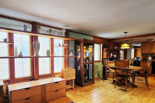 a view of a workspace with furniture and window