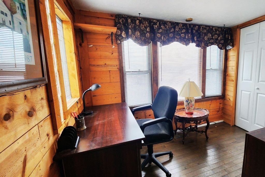 3040 Cranberry Highway, Unit 34 Wareham, MA 02538 - Photo 9 of 14 a view of a livingroom with lounge chair and a large window