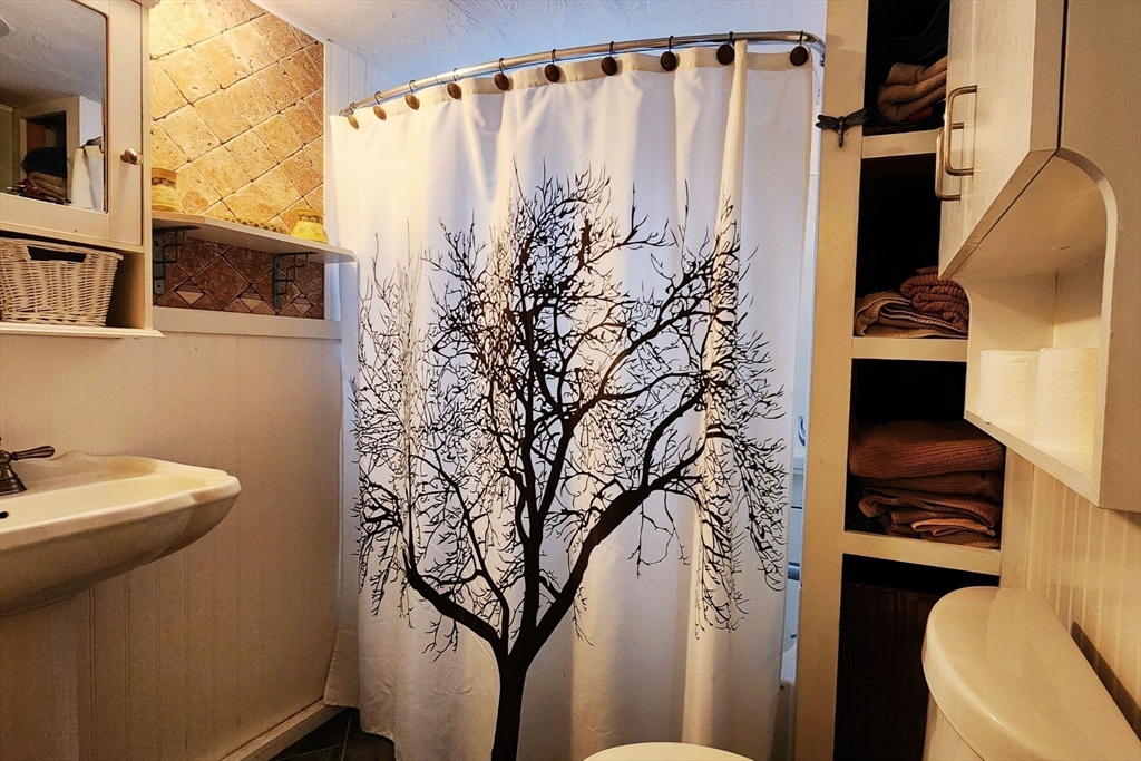 3040 Cranberry Highway, Unit 34 Wareham, MA 02538 - Photo 10 of 14 a bathroom with a toilet sink and tub