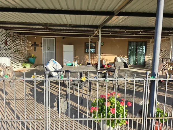 a view of a porch with furniture