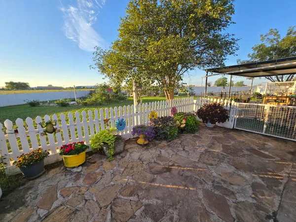 a view of a park with iron fence