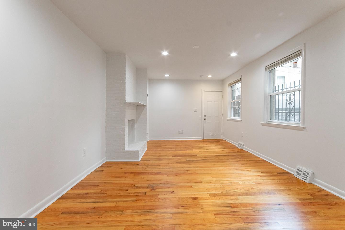 1516 Addison Street Philadelphia, PA 19146 - Photo 2 of 10 a view of empty room with wooden floor and fan