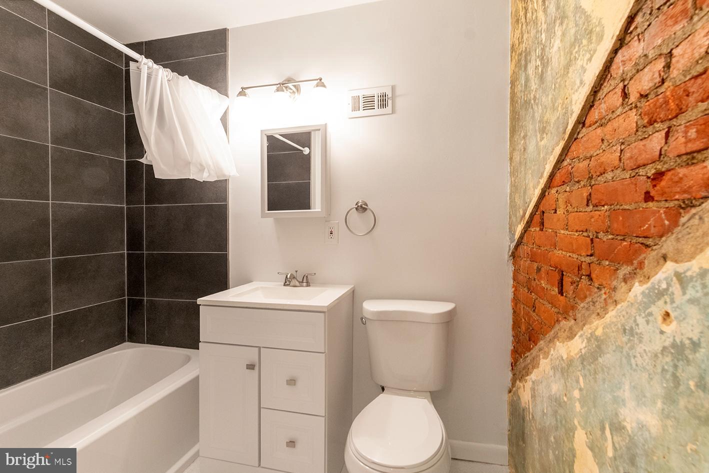 1516 Addison Street Philadelphia, PA 19146 - Photo 4 of 10 a bathroom with a sink toilet and shower