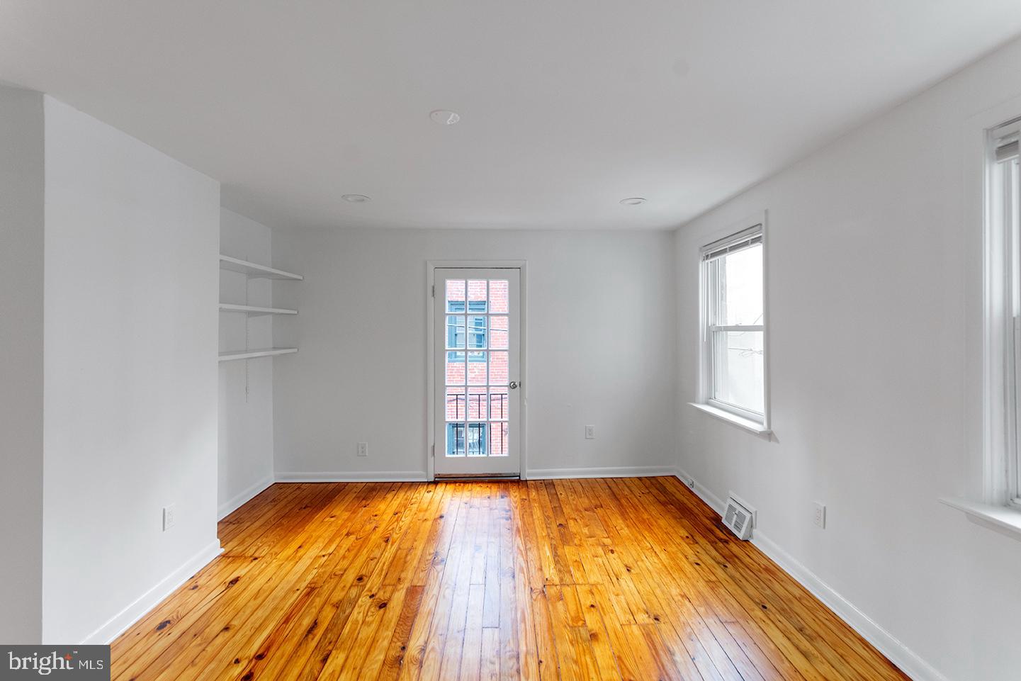 1516 Addison Street Philadelphia, PA 19146 - Photo 5 of 10 an empty room with a window