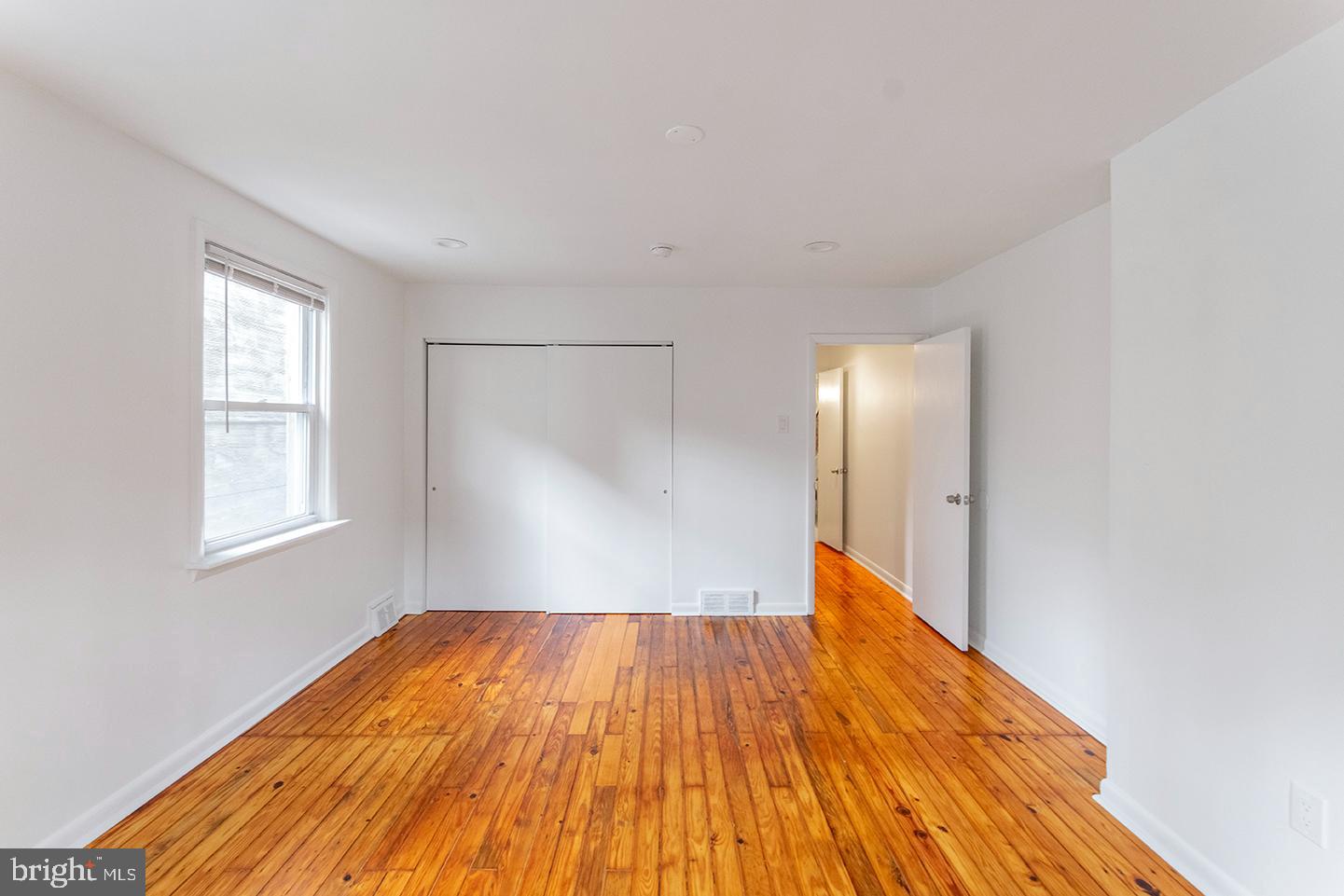 1516 Addison Street Philadelphia, PA 19146 - Photo 6 of 10 a view of empty room with wooden floor