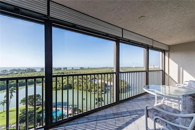 a view of a balcony with furniture