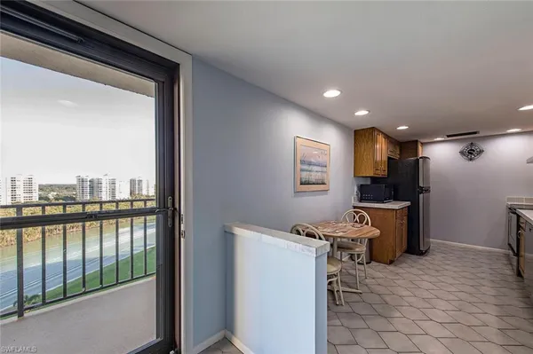 a view of a kitchen with a sink and cabinets