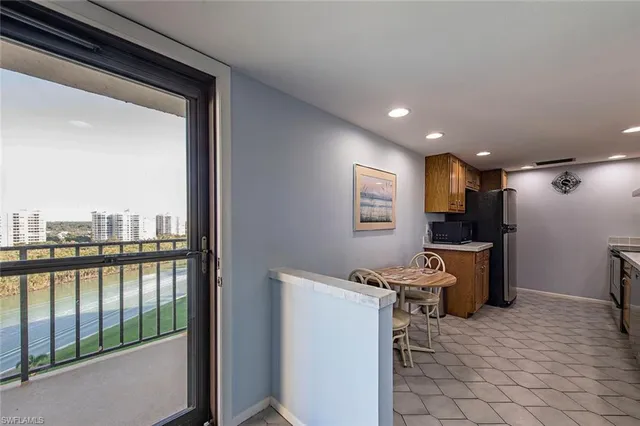 a view of a kitchen with a sink and cabinets