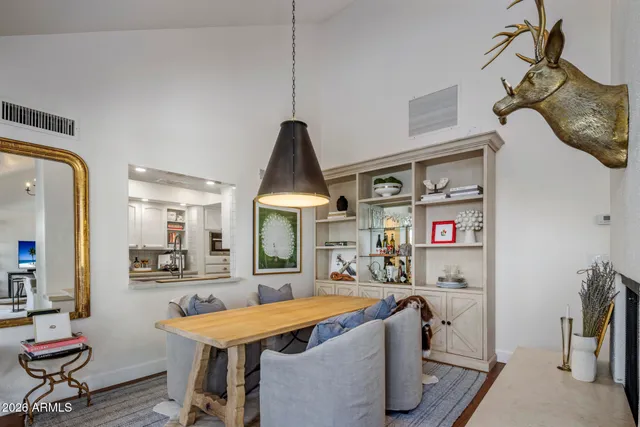 a room with furniture a flat screen tv and a table