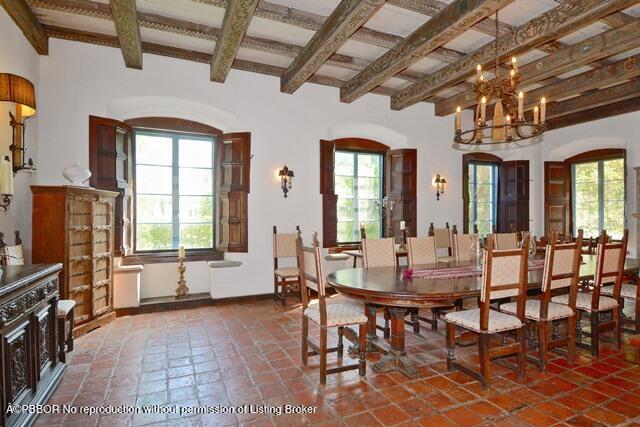 Undisclosed Address Palm Beach, FL 33480 - Photo 13 of 33 a dining room with wooden floor a chandelier a wooden table and chairs