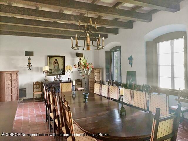 Undisclosed Address Palm Beach, FL 33480 - Photo 14 of 33 a view of a dining room with furniture wooden floor and a chandelier