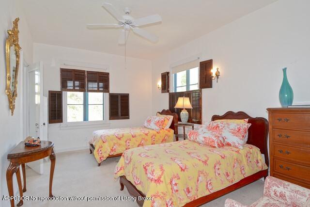 Undisclosed Address Palm Beach, FL 33480 - Photo 26 of 33 a bedroom with two beds and a window