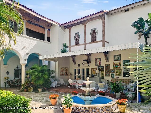 Undisclosed Address Palm Beach, FL 33480 - Photo 29 of 33 a front view of house with yard outdoor seating and barbeque oven