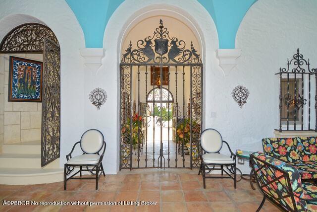 Undisclosed Address Palm Beach, FL 33480 - Photo 6 of 33 a front view of a house with entryway