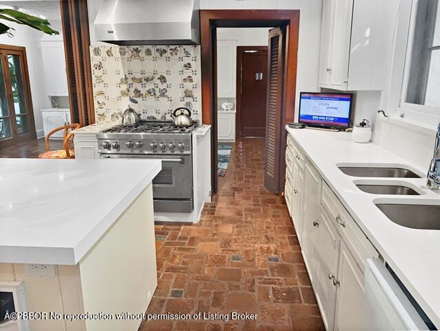 Undisclosed Address Palm Beach, FL 33480 - Photo 10 of 33 a kitchen with stainless steel appliances granite countertop a stove a sink and a refrigerator