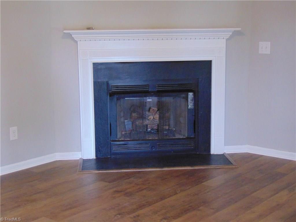 6819 Rangecrest Road Belews Creek, NC 27009 - Photo 17 of 30 Living room fireplace features gas logs!