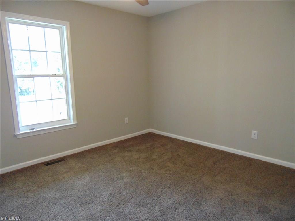 6819 Rangecrest Road Belews Creek, NC 27009 - Photo 20 of 30 2nd bedroom has new carpet and fan as well!