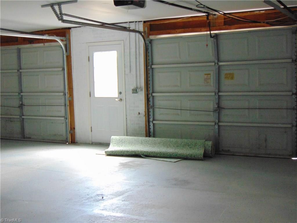 6819 Rangecrest Road Belews Creek, NC 27009 - Photo 26 of 30 Large 2-door garage has door to access outdoors!