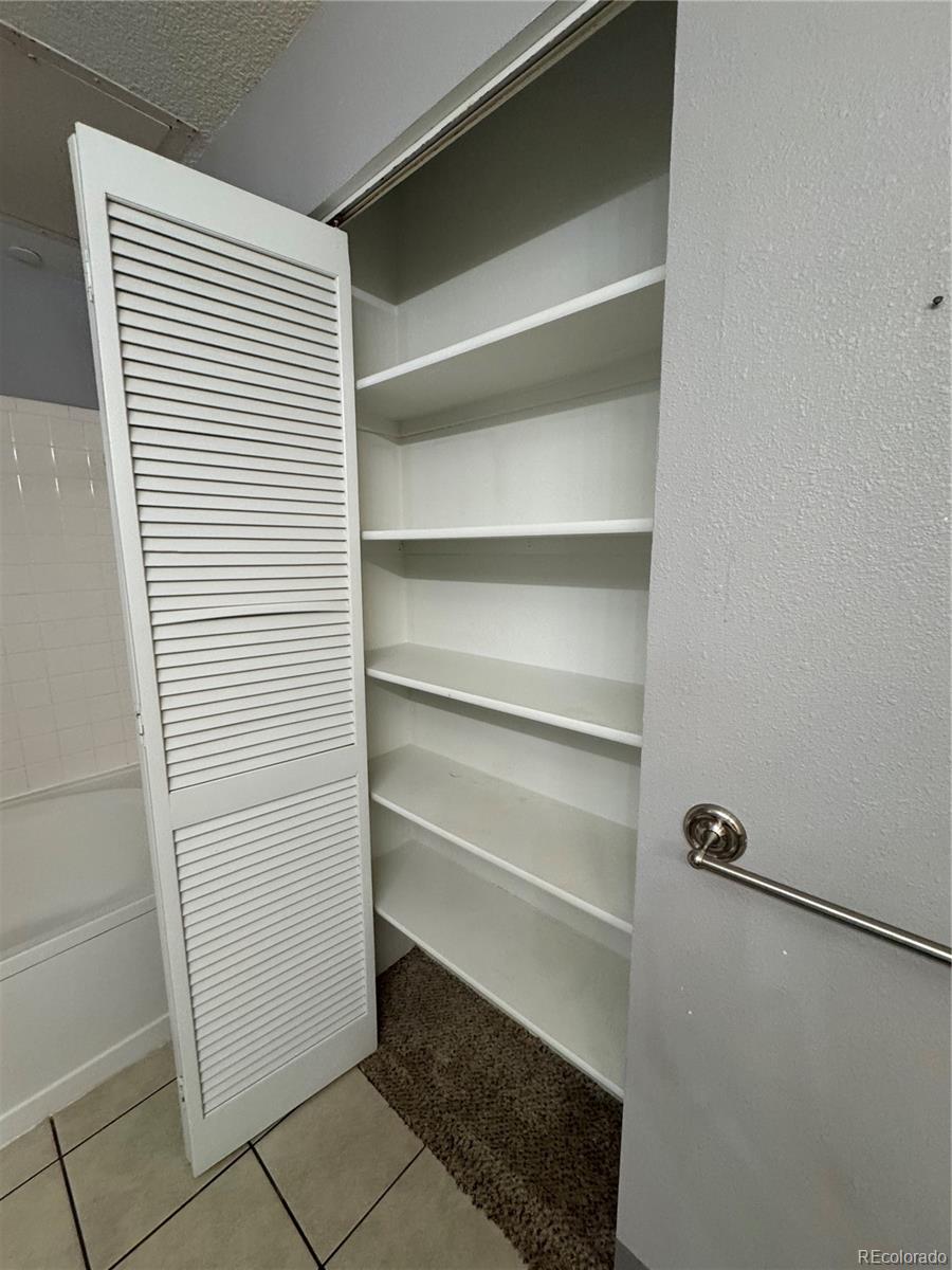 1815 Spaulding Circle Superior, CO 80027 - Photo 17 of 24 a view of walk in closet with empty racks