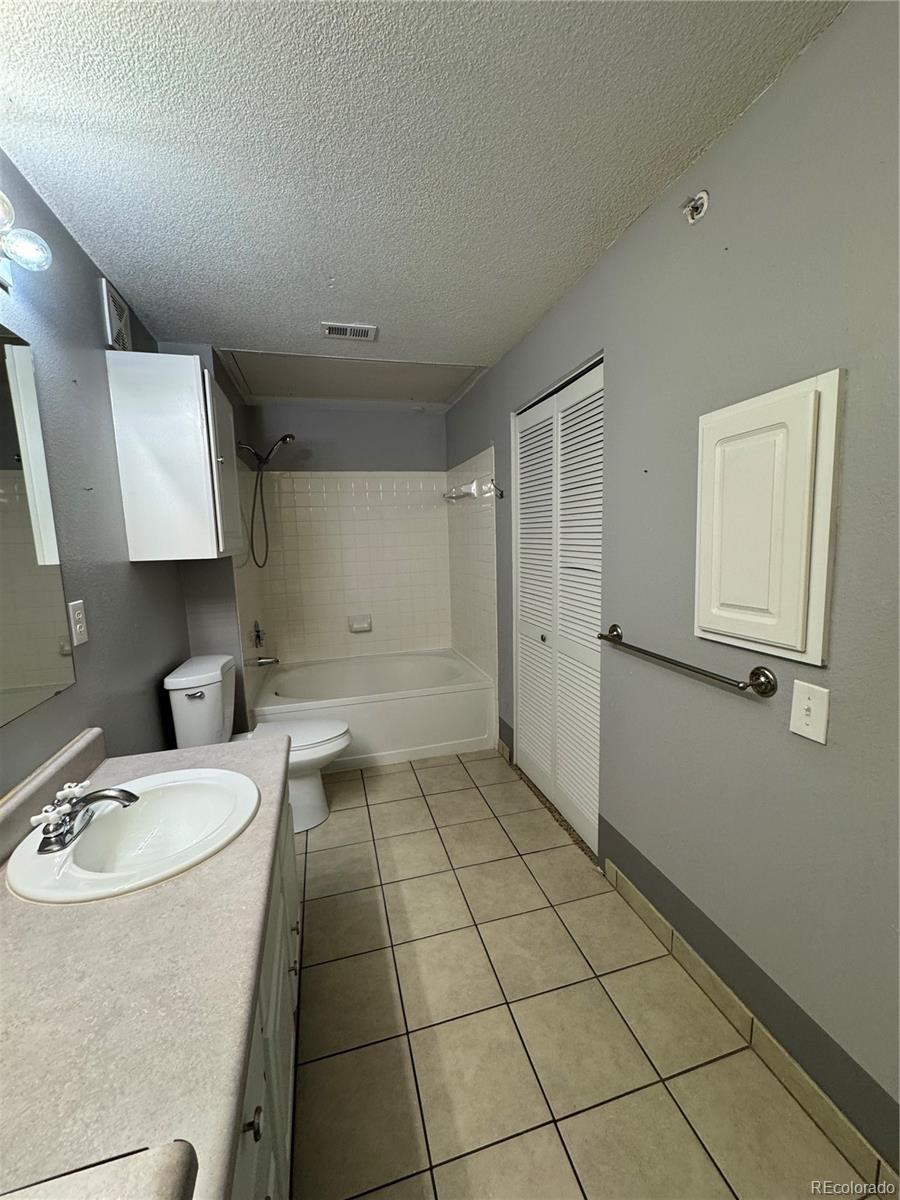1815 Spaulding Circle Superior, CO 80027 - Photo 18 of 24 a bathroom with a sink a toilet and mirror