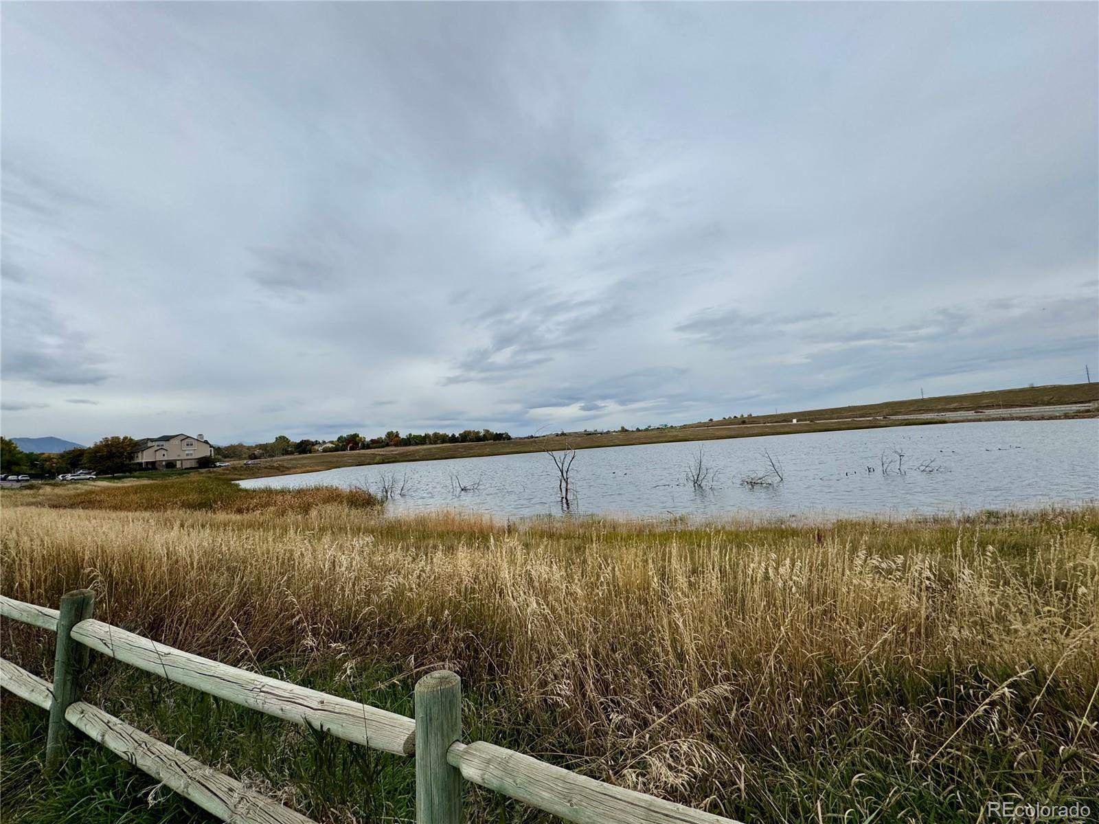 1815 Spaulding Circle Superior, CO 80027 - Photo 2 of 24 a view of a lake from a yard