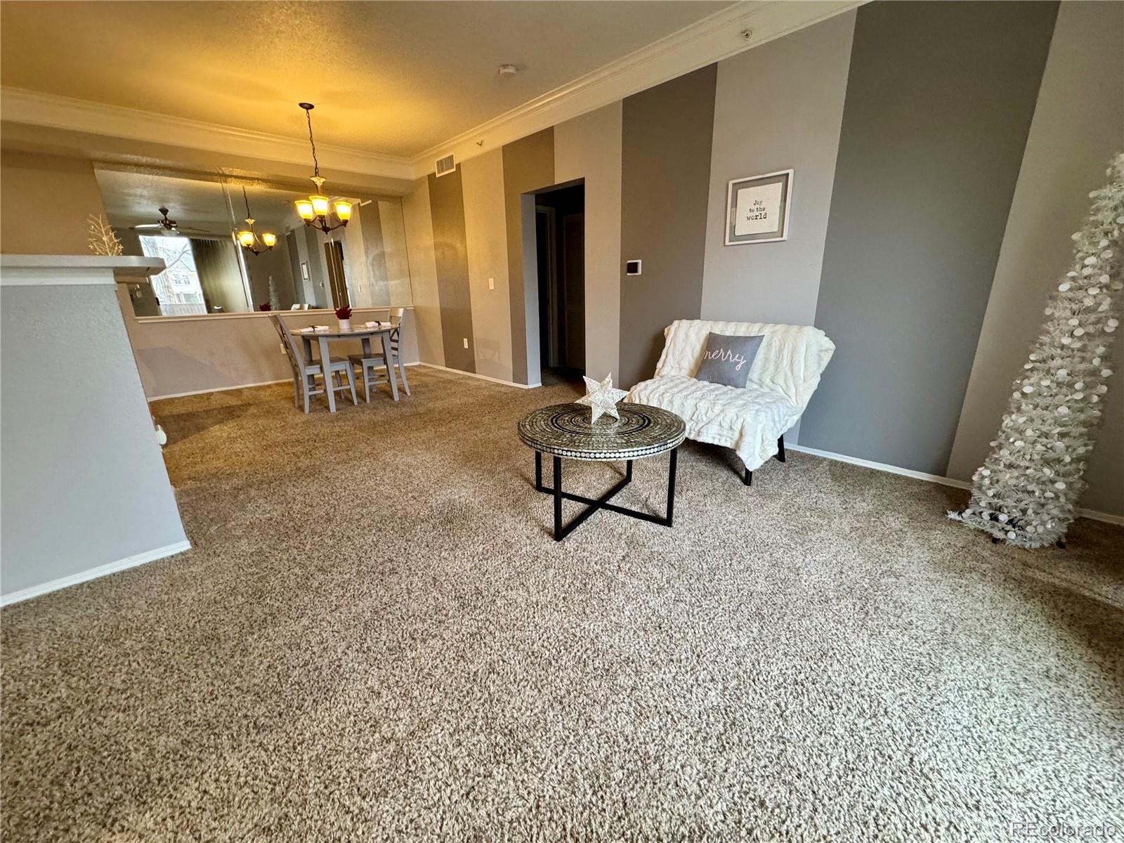 1815 Spaulding Circle Superior, CO 80027 - Photo 5 of 24 a living room with furniture and a chandelier