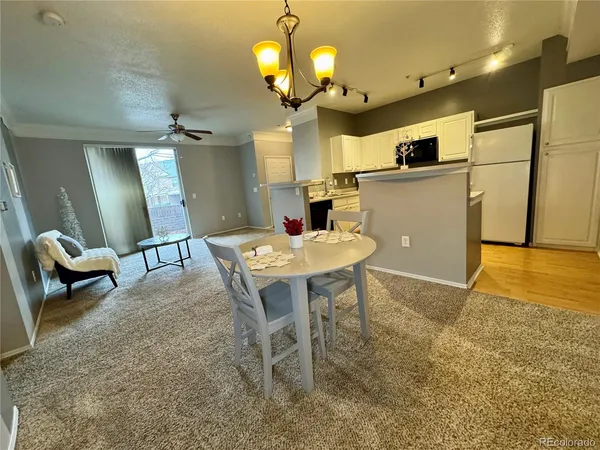 a view of a kitchen and dining room