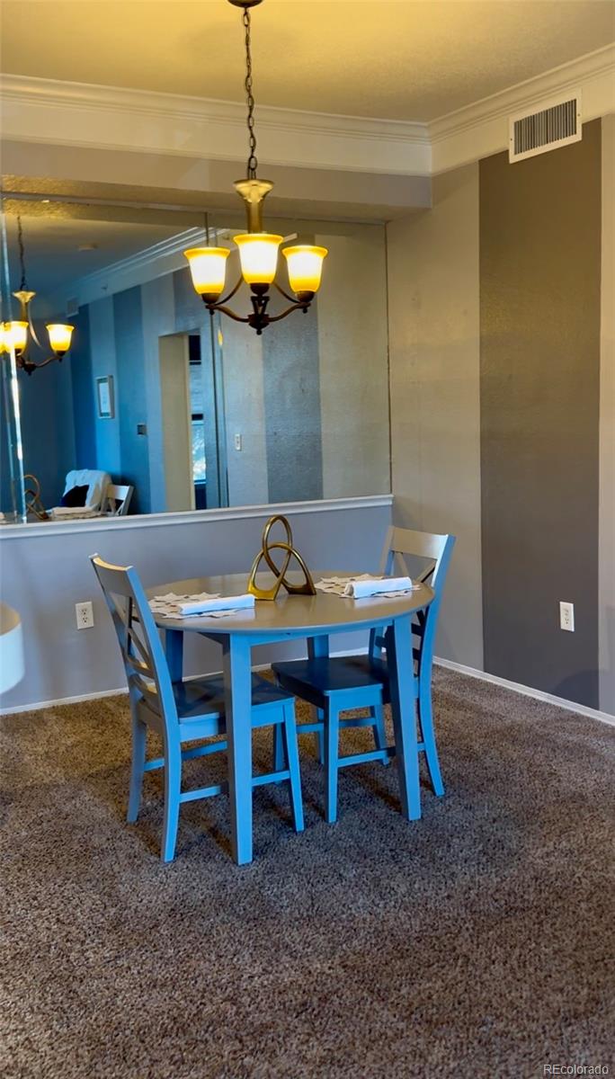 1815 Spaulding Circle Superior, CO 80027 - Photo 10 of 24 a view of a dining room with furniture and chandelier