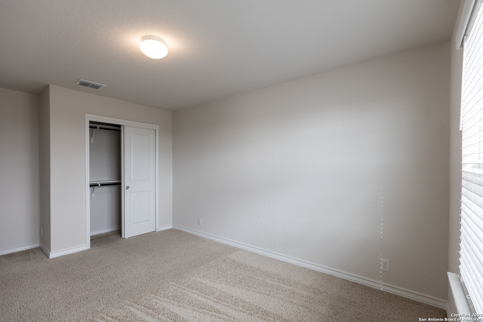 9819 Bratten Rise San Antonio, TX 78254 - Photo 28 of 37 a view of an empty room and a window