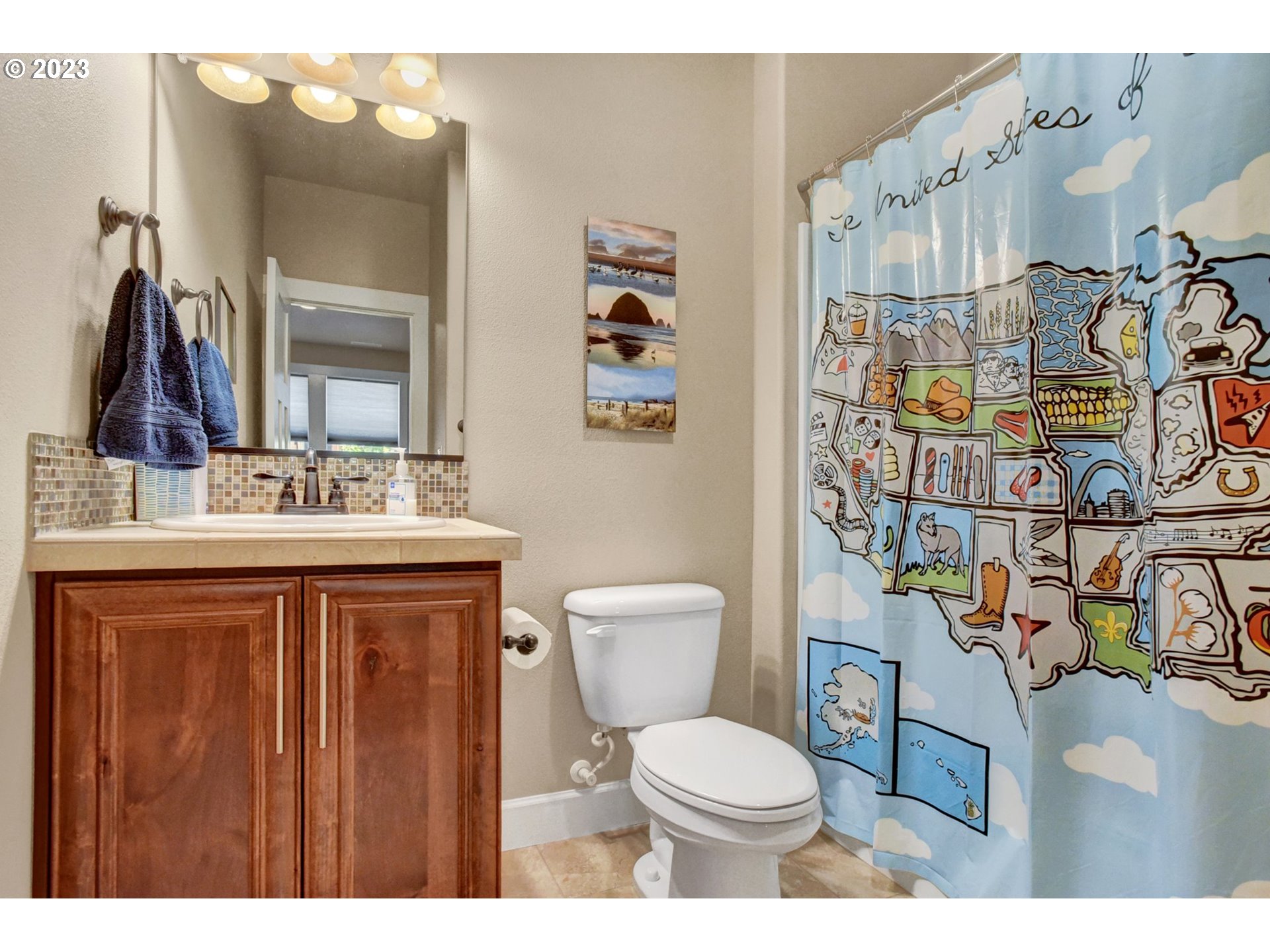 1710 South Nighthawk Road Ridgefield, WA 98642 - Photo 24 of 44 a bathroom with a sink vanity mirror and toilet