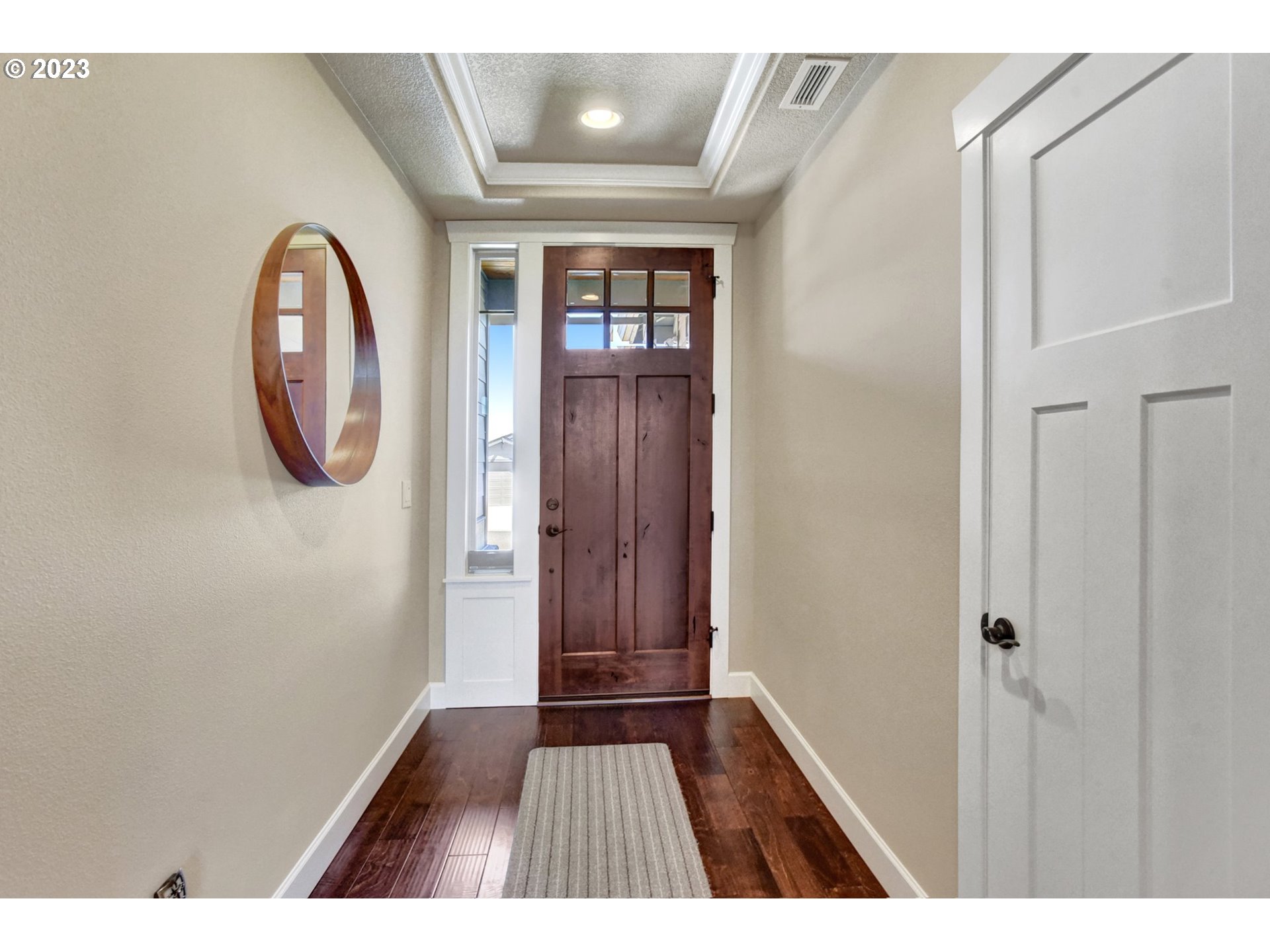 1710 South Nighthawk Road Ridgefield, WA 98642 - Photo 4 of 44 a view of front door with wooden floor