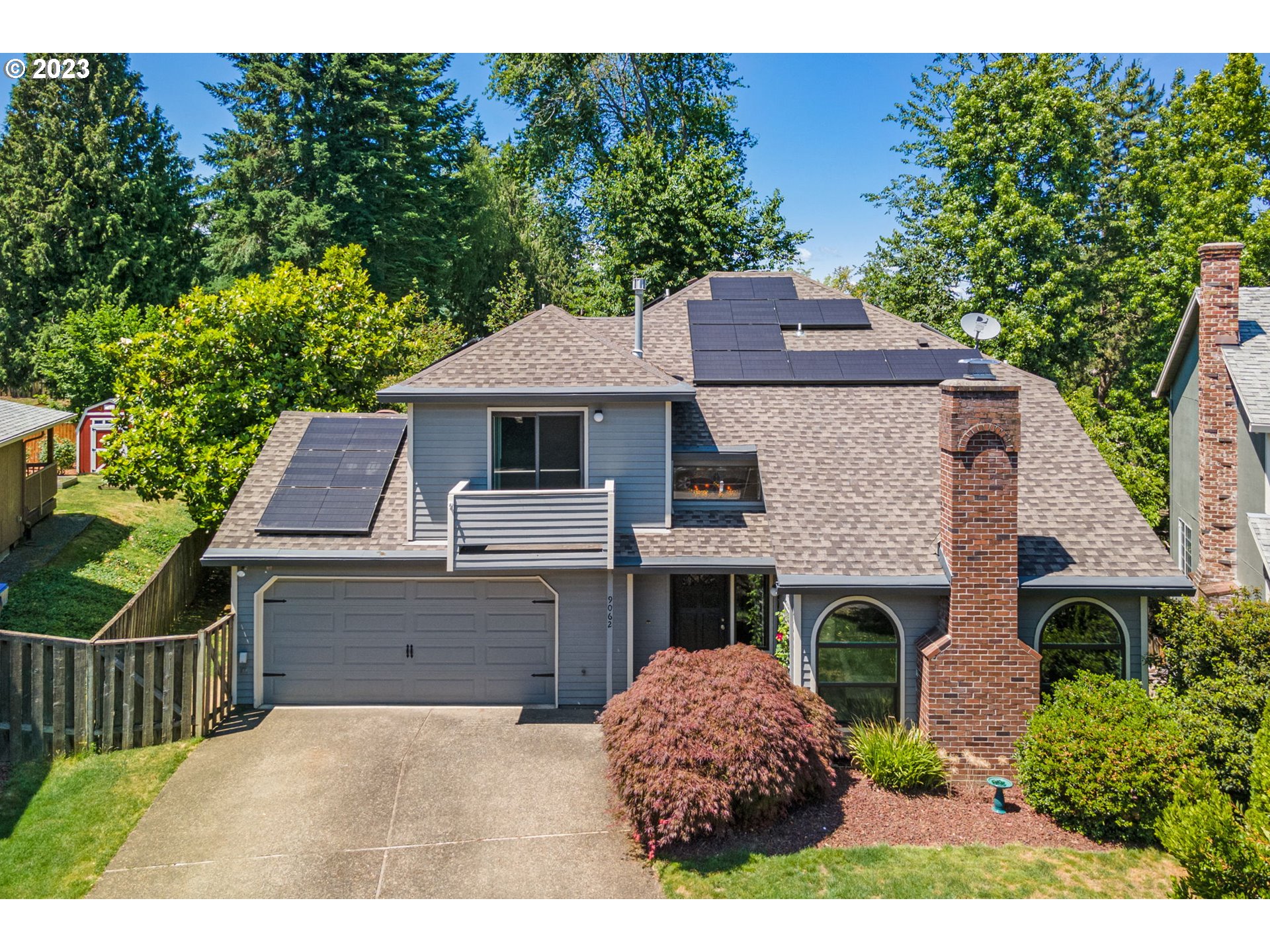 a aerial view of a house with a garden and plants