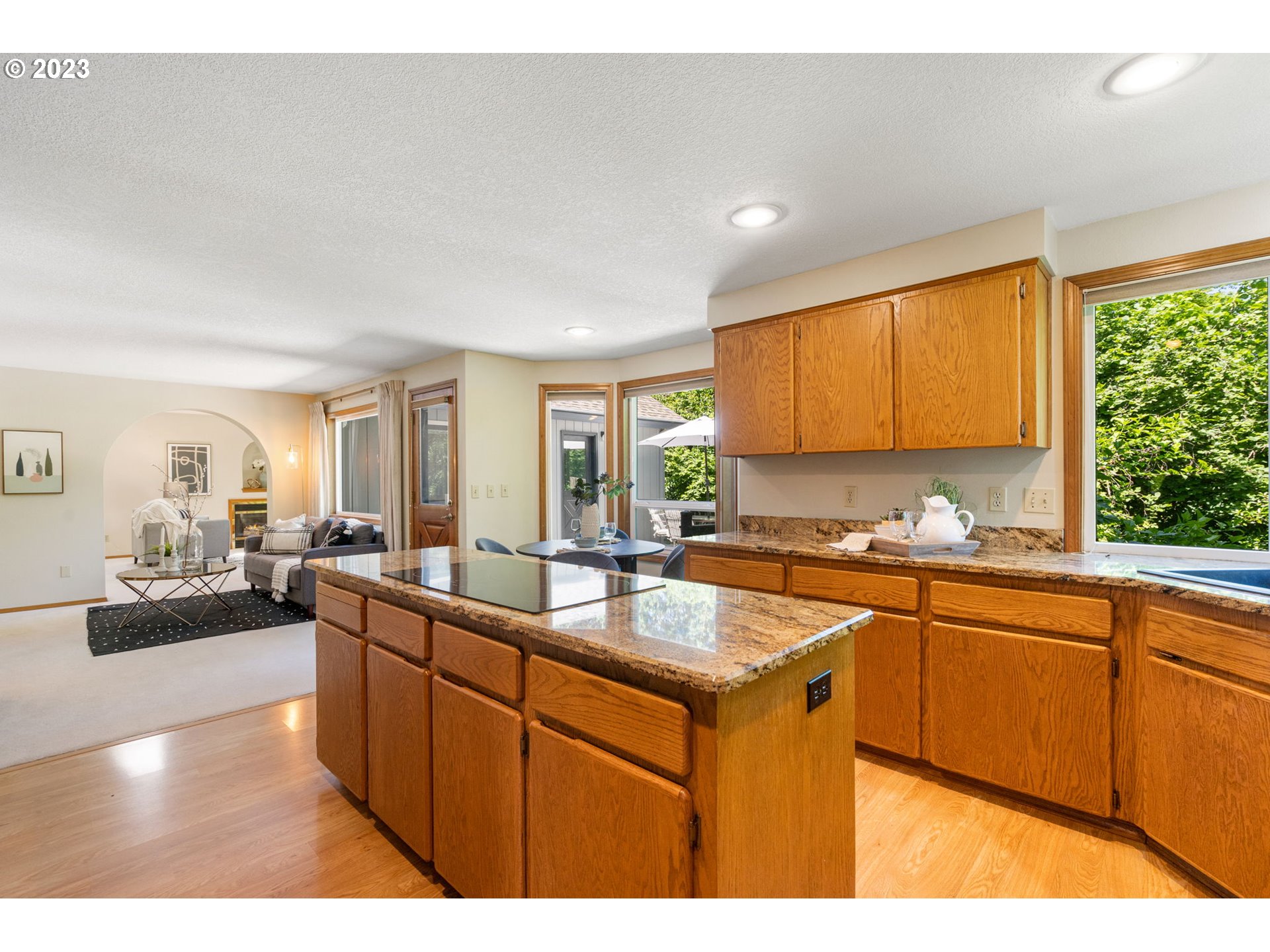 9062 Southwest Hill Street Portland, OR 97223 - Photo 12 of 48 a kitchen with a sink stove and cabinets