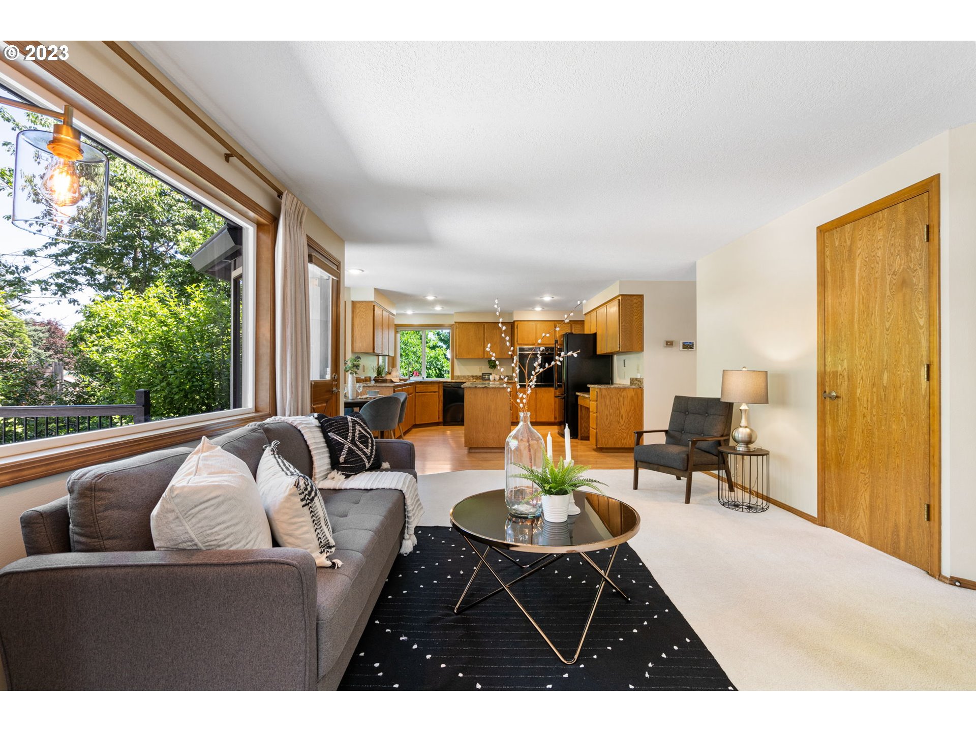9062 Southwest Hill Street Portland, OR 97223 - Photo 13 of 48 a living room with furniture and a large window