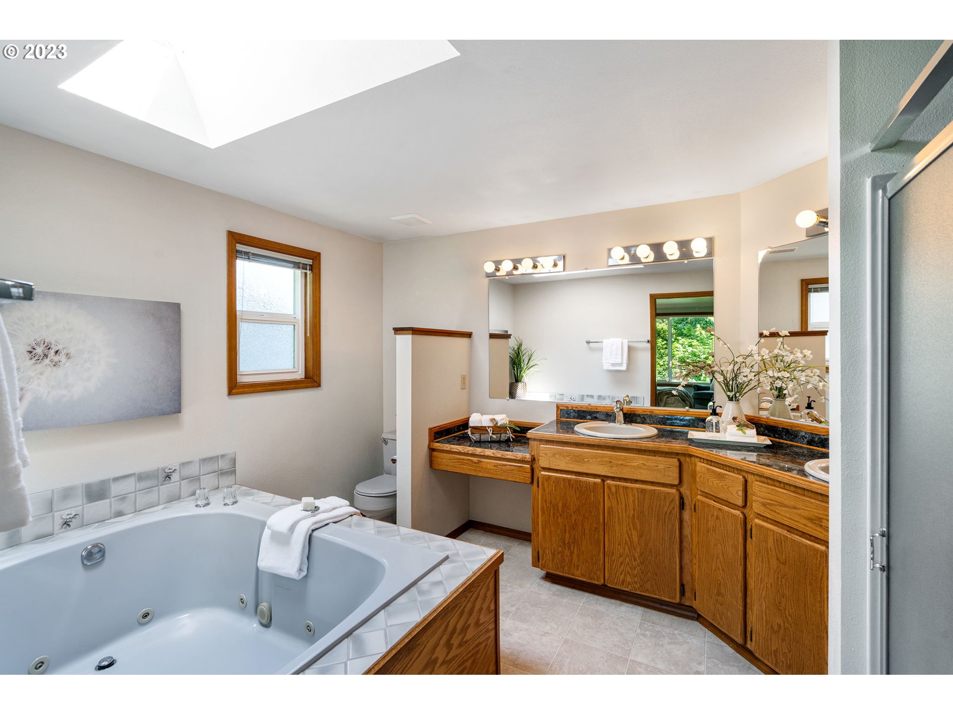 9062 Southwest Hill Street Portland, OR 97223 - Photo 27 of 48 a kitchen with a sink a stove and cabinets