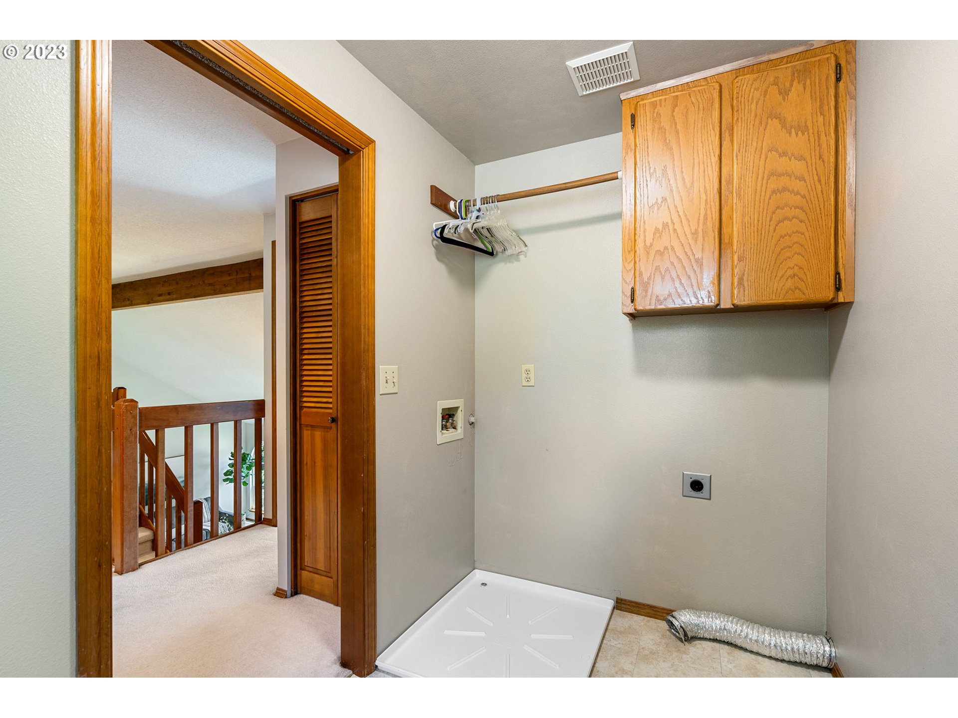 9062 Southwest Hill Street Portland, OR 97223 - Photo 33 of 48 a view hallway with wooden floor and a bathroom