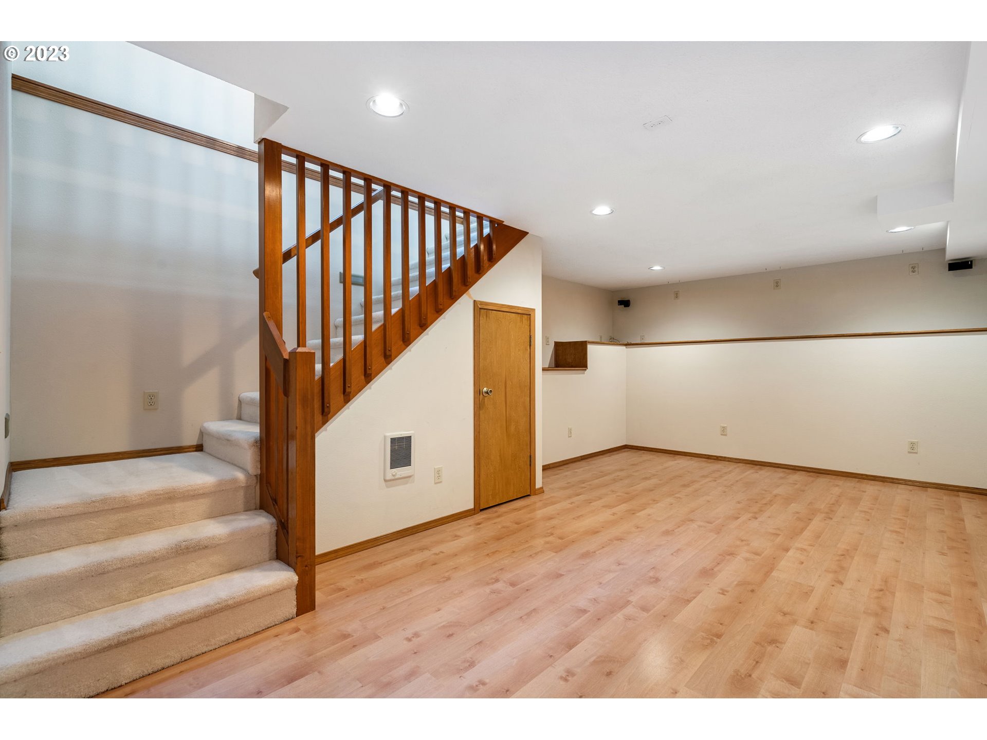 9062 Southwest Hill Street Portland, OR 97223 - Photo 34 of 48 a view of an entryway wooden floor and stairs