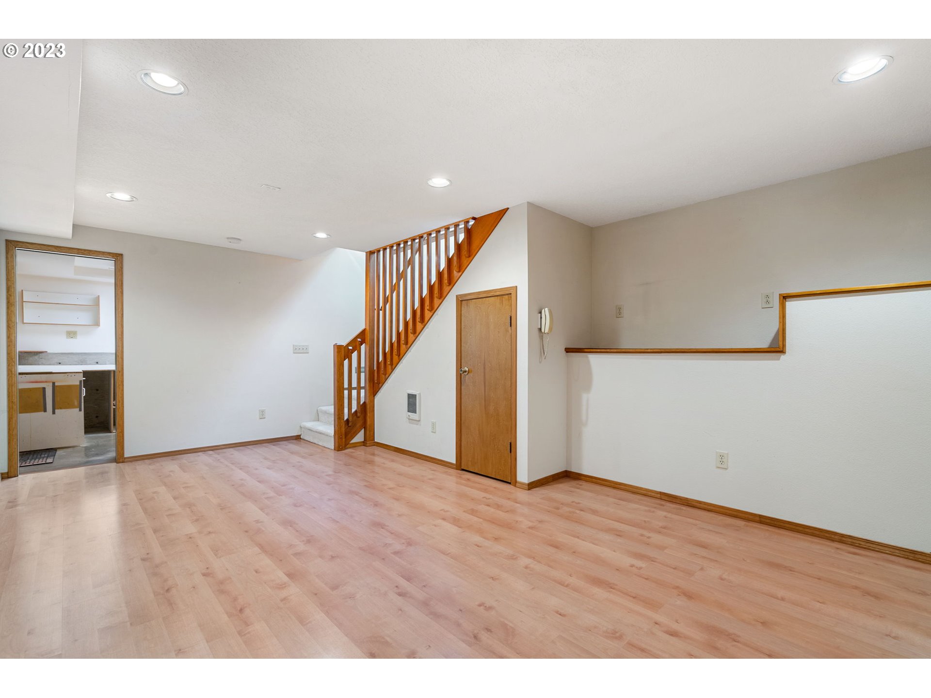 9062 Southwest Hill Street Portland, OR 97223 - Photo 35 of 48 a view of an empty room with wooden floor